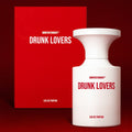 Drunk Lovers Eau de Parfum bottle and box, featuring bold design and red accents for a striking look.